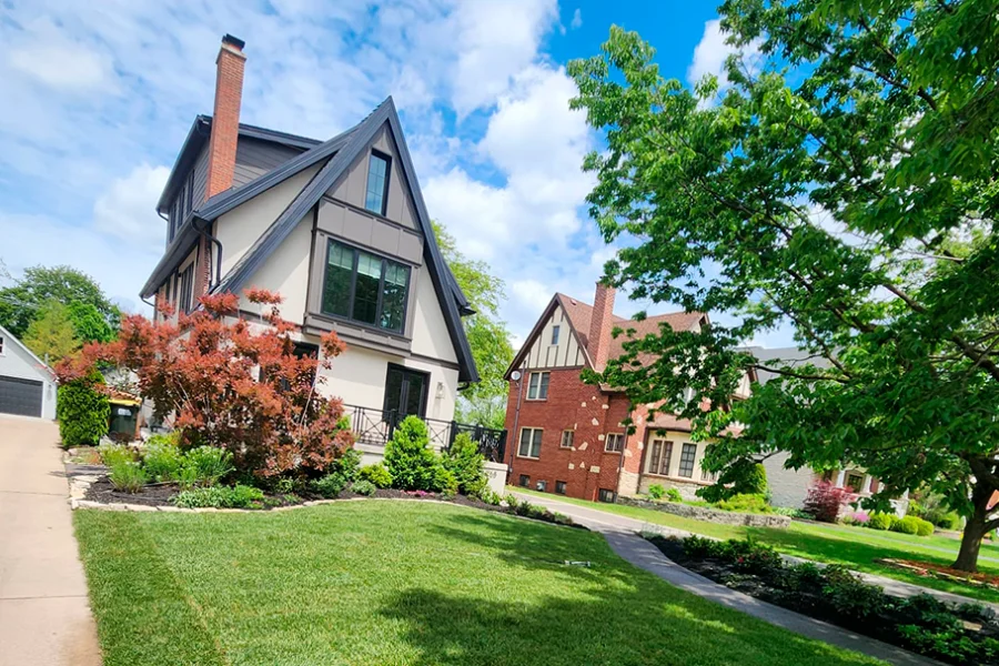 Residential front yard landscaping with manicured lawn and ornamental trees in Chicago suburbs